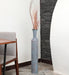Crafted of metal, this stunning vase strikes an updated amphora silhouette with a 32" H x 8" W cylindrical body and a flared mouth. Perfect for long-stemmed florals, decorative twigs, or unfilled as a sculptural accent, Its ambiguous qualities make it a magnetic piece that guests won't be able to keep their eyes off of. This vase can be simply wiped with a dry cloth for effortless upkeep.