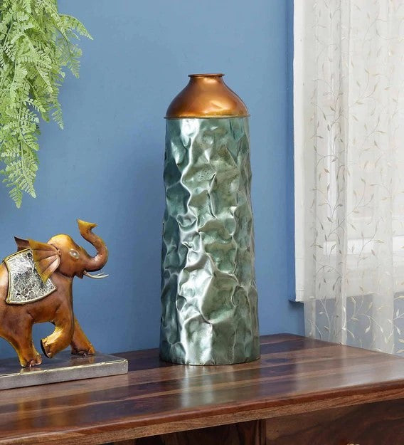 This vase decor piece gives a unique touch to your home and enhances the style of the room. Show off your style and character with this beautiful accent piece.