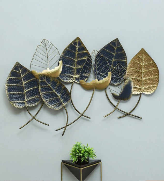 Add charm to your home with this stunning all metal leaf wall decor with its multicolor and additional gold highlights. The one piece wall decor features eight large leaves. Its trendy design makes it an eye-catching addition to any contemporary inspired decor. It is perfect for any entryway, living room, or bedroom to add personality to empty walls.