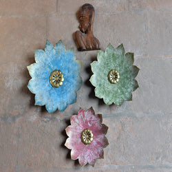 This lovely three piece set of wall hanging Flora in gold center are sure to add charm to any space. The flower are crafted entirely of metal and features a nature inspire design. This flora wall art can hang individually, so you can choose to display them together or in different parts of your room.