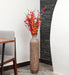 Crafted of metal, this stunning vase strikes an updated amphora silhouette with a 32" H x 8" W cylindrical body and a flared mouth. Perfect for long-stemmed florals, decorative twigs, or unfilled as a sculptural accent, Its ambiguous qualities make it a magnetic piece that guests won't be able to keep their eyes off of. This vase can be simply wiped with a dry cloth for effortless upkeep.