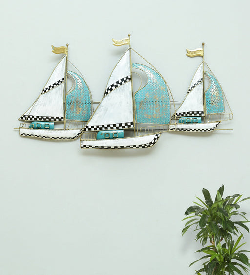 It consists of one sailboat design, it is constructed wrought iron that offers lasting usage, accented with multi coloured finish. Give your home space a unique coastal inspired theme by adding this beautiful looking sailboat decor accent.