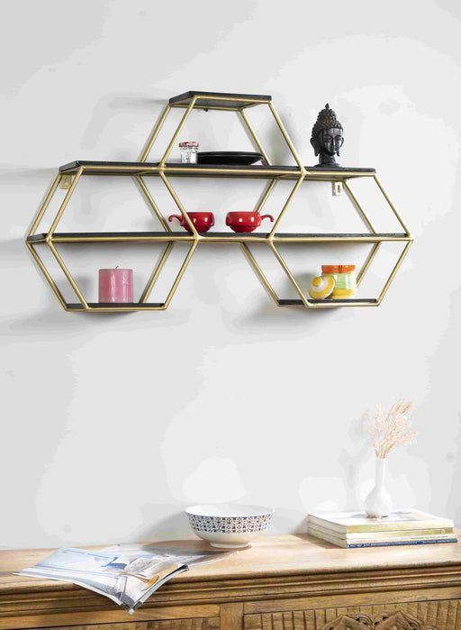 Turn any empty wall into a contemporary display with this wall shelf. Crafted of metal in a gold finish, Inside, nine shelves are laid out asymmetrically – each a different size and shape – for you to display books, framed photos, small sculptures, and collected curios. Measuring 19" H x 34" W x 7" D overall, this shelf includes keyhole hangers for effortless installation.