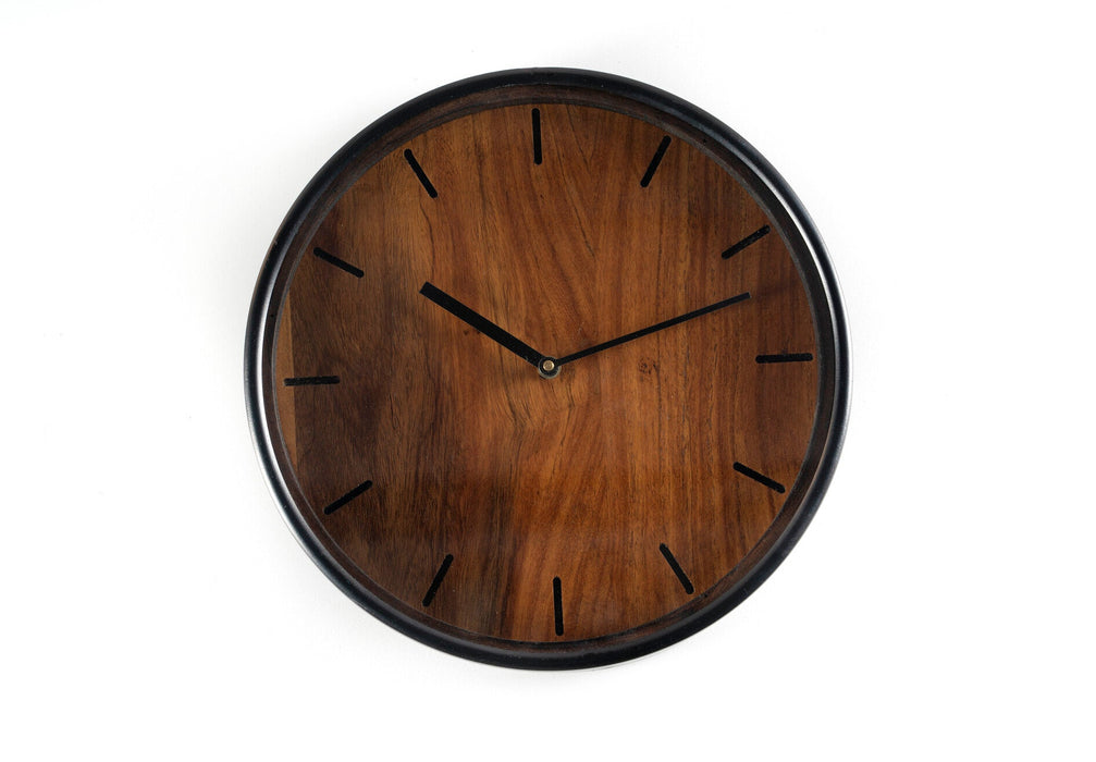 Nothing ties a room together better than a great clock, and the one you choose to place in your home should reflect your personality and style. Our wall clock will bring the timeless appeal you've been looking for to any home or office. Crafted of solid wood with a black finish, this elegant timepiece blends perfectly with both farmhouse and traditional decor. The classic numerals are easy to read, while the versatile 12" size makes it a chic addition to any room.