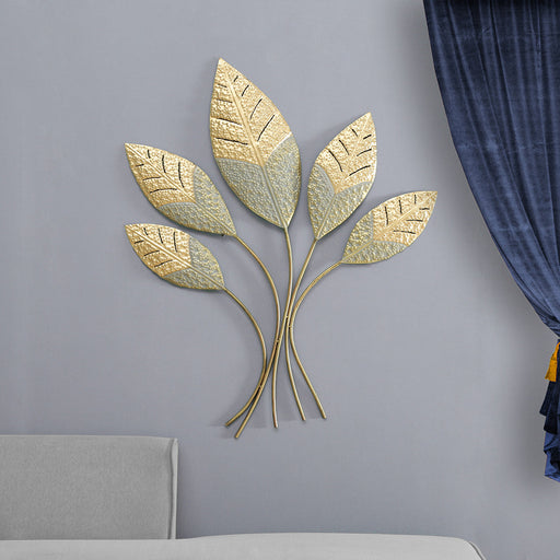 Show off your love of artistic flair with Vedas Exports Metal Multicolour Leaves Wall Decor. This wonderfully handcrafted metal art features an intricate leaf design that highlights the structural beauty of different stalks of leaves. A gold finish creates further definition and makes it pop off your wall. This beautiful leaf decor comes ready to hang.